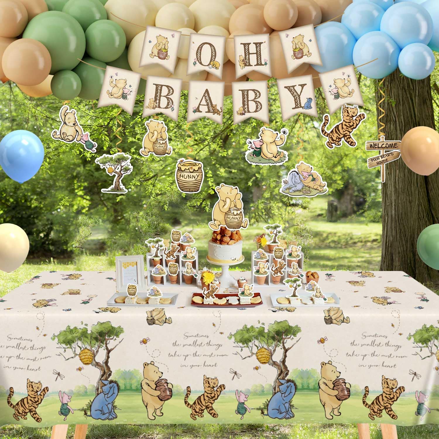 Oh Baby banner hanging swirls and cake toppers for photos
