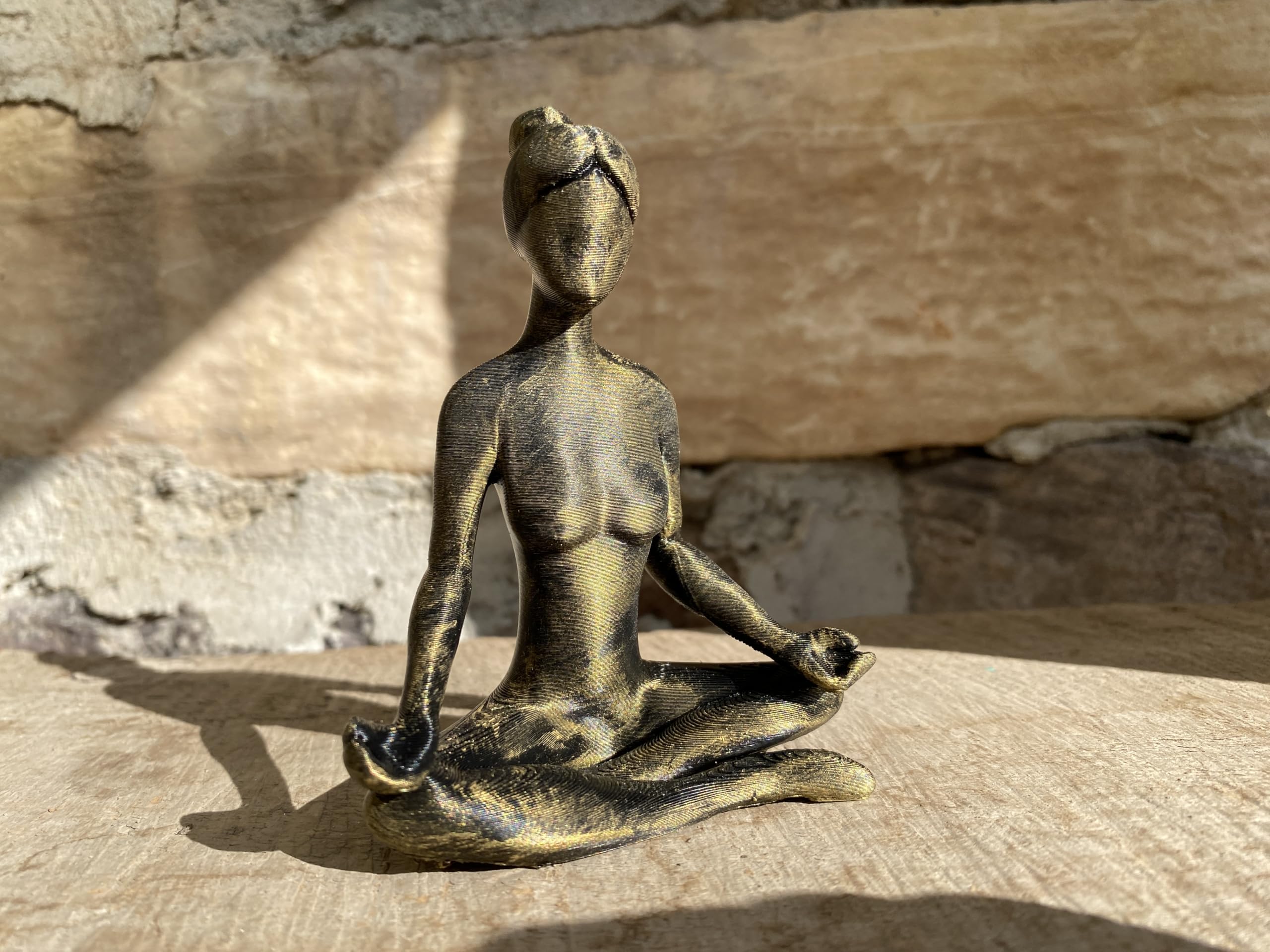 One-of-a-kind decor piece meditating statue closeup