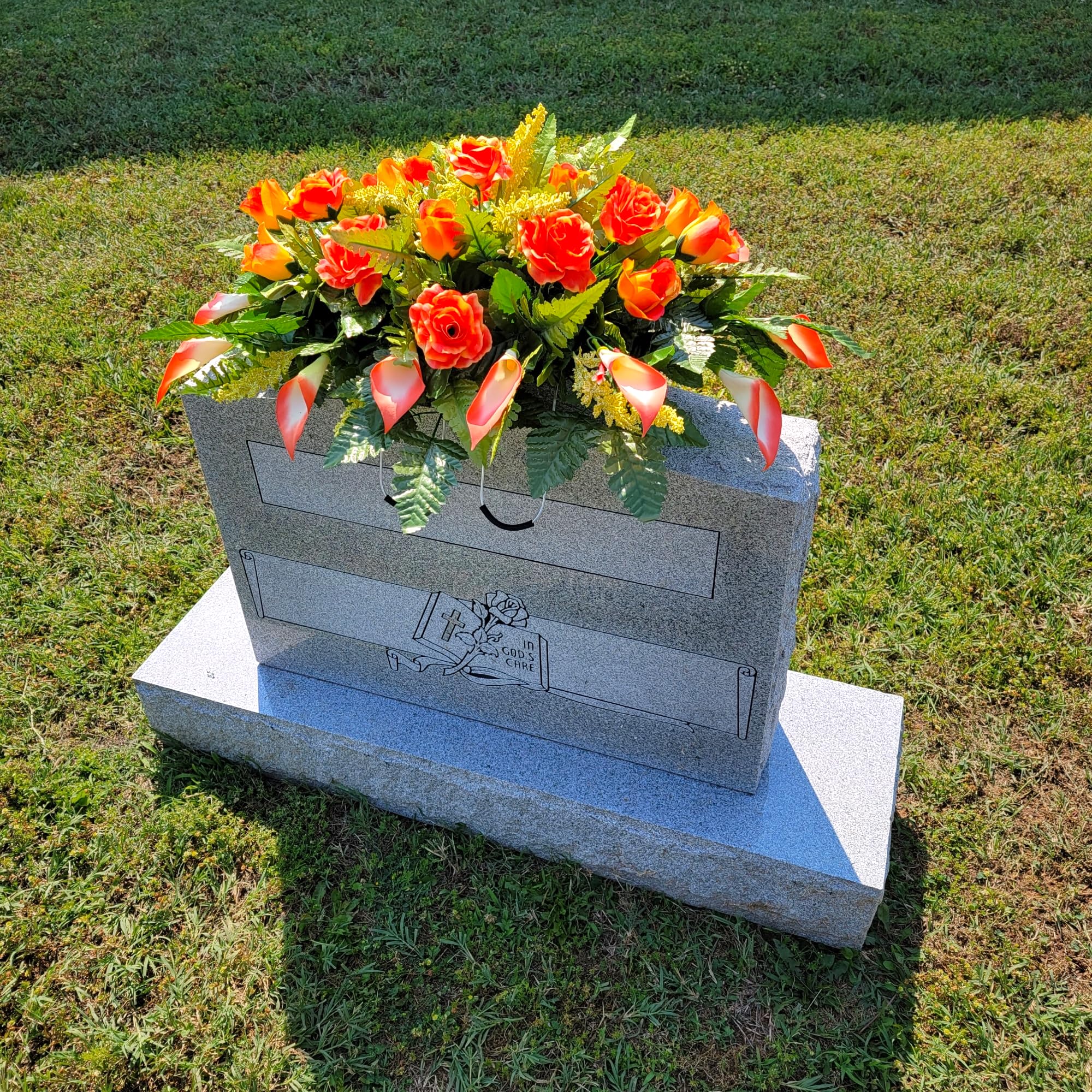 Silk grave flowers saddle on a four-leg metal frame