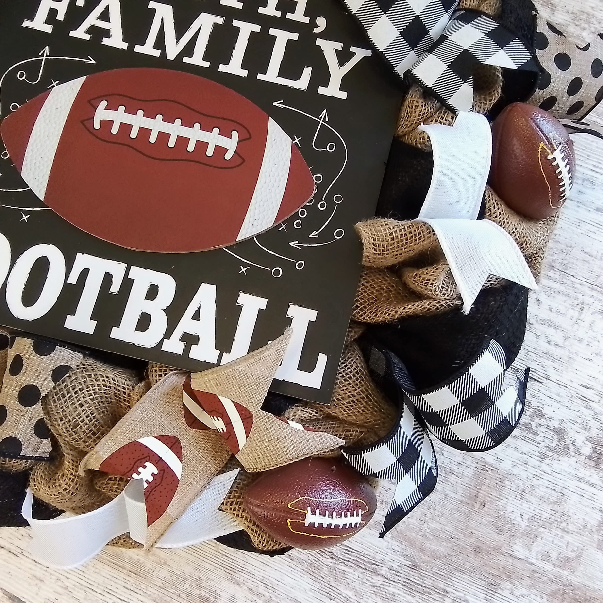 Outdoor front door wreath made of burlap with football ribbons