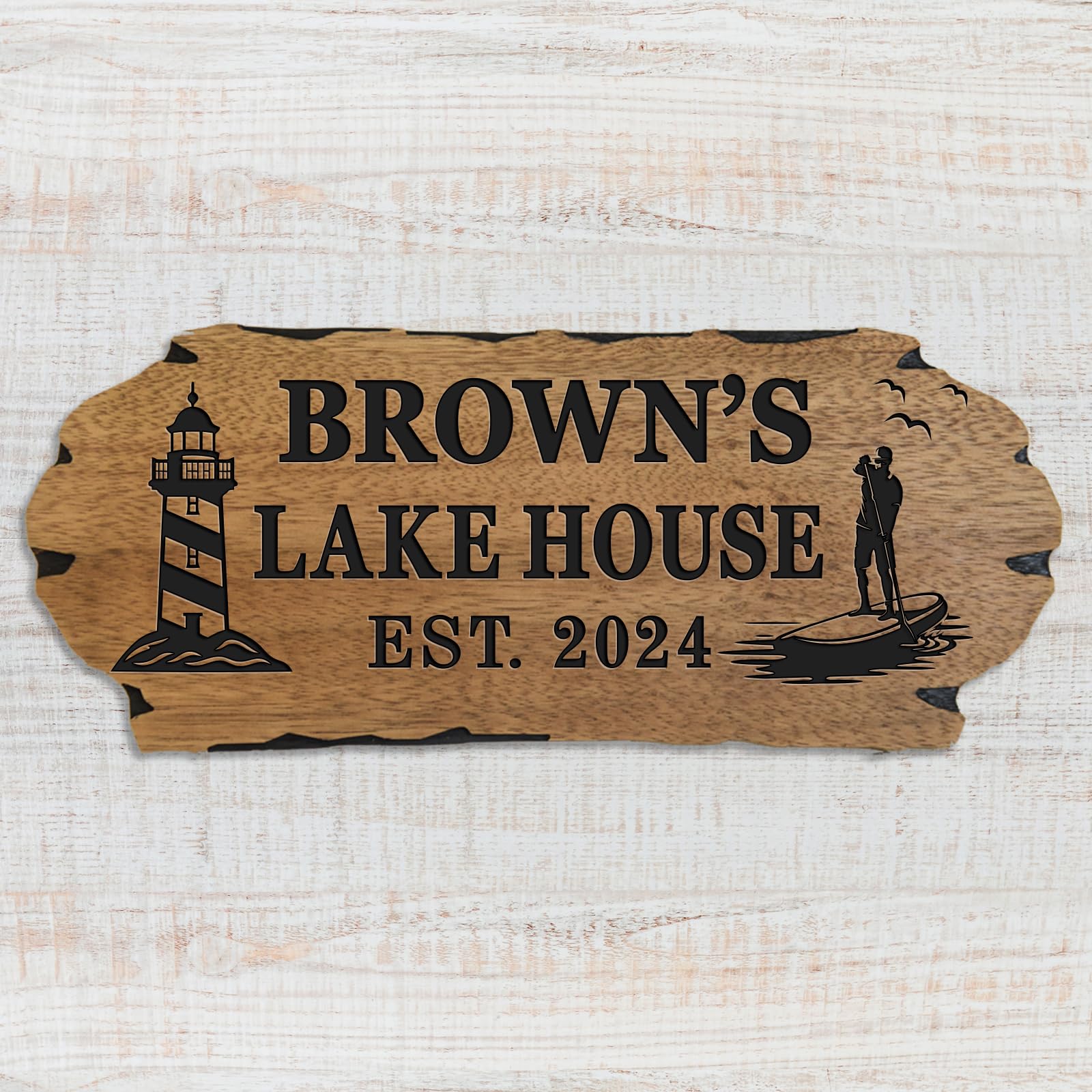 Outdoor wooden sign featuring lighthouse motif and sealer finish