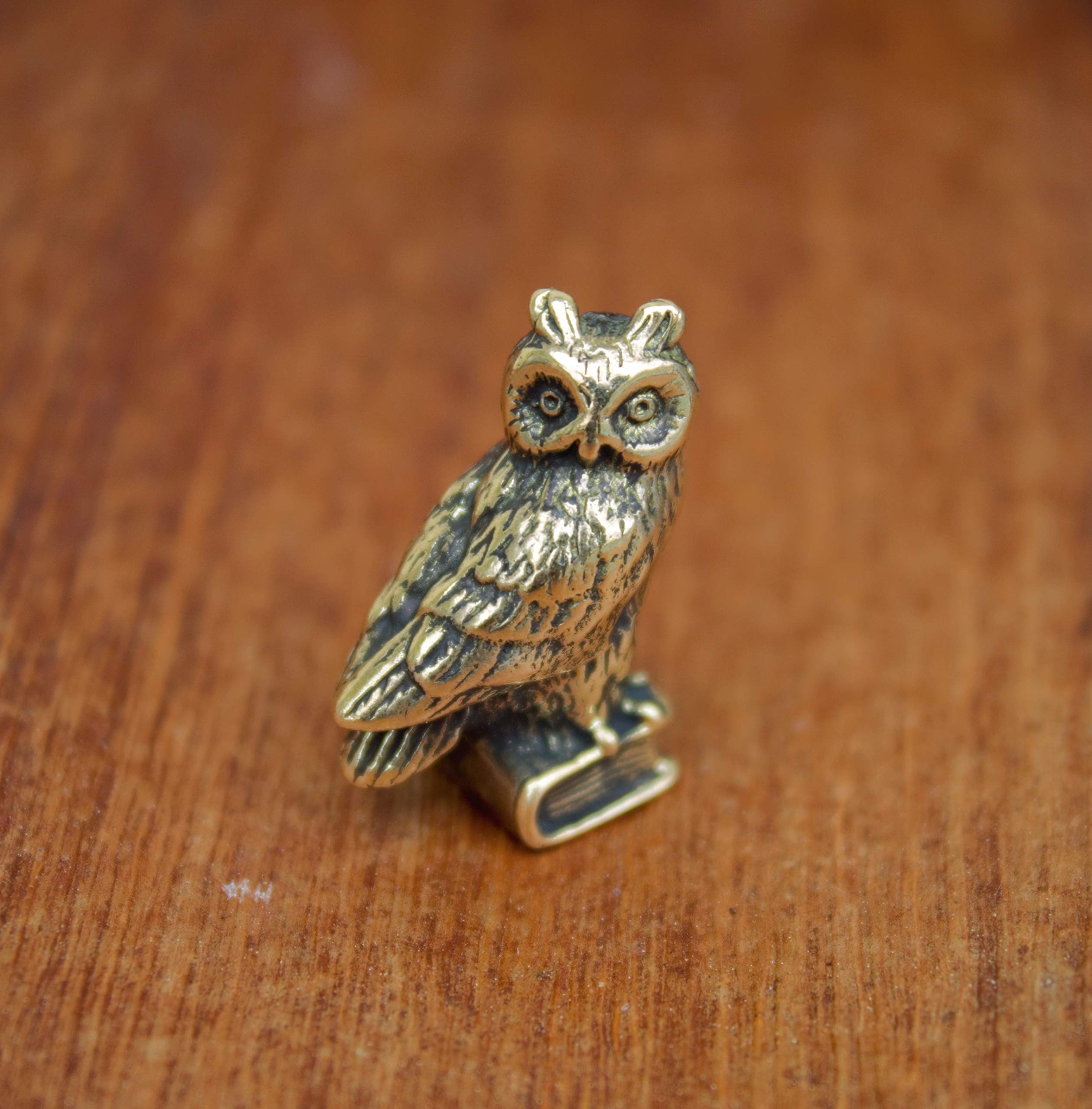 Decorative brass owl ornament on display