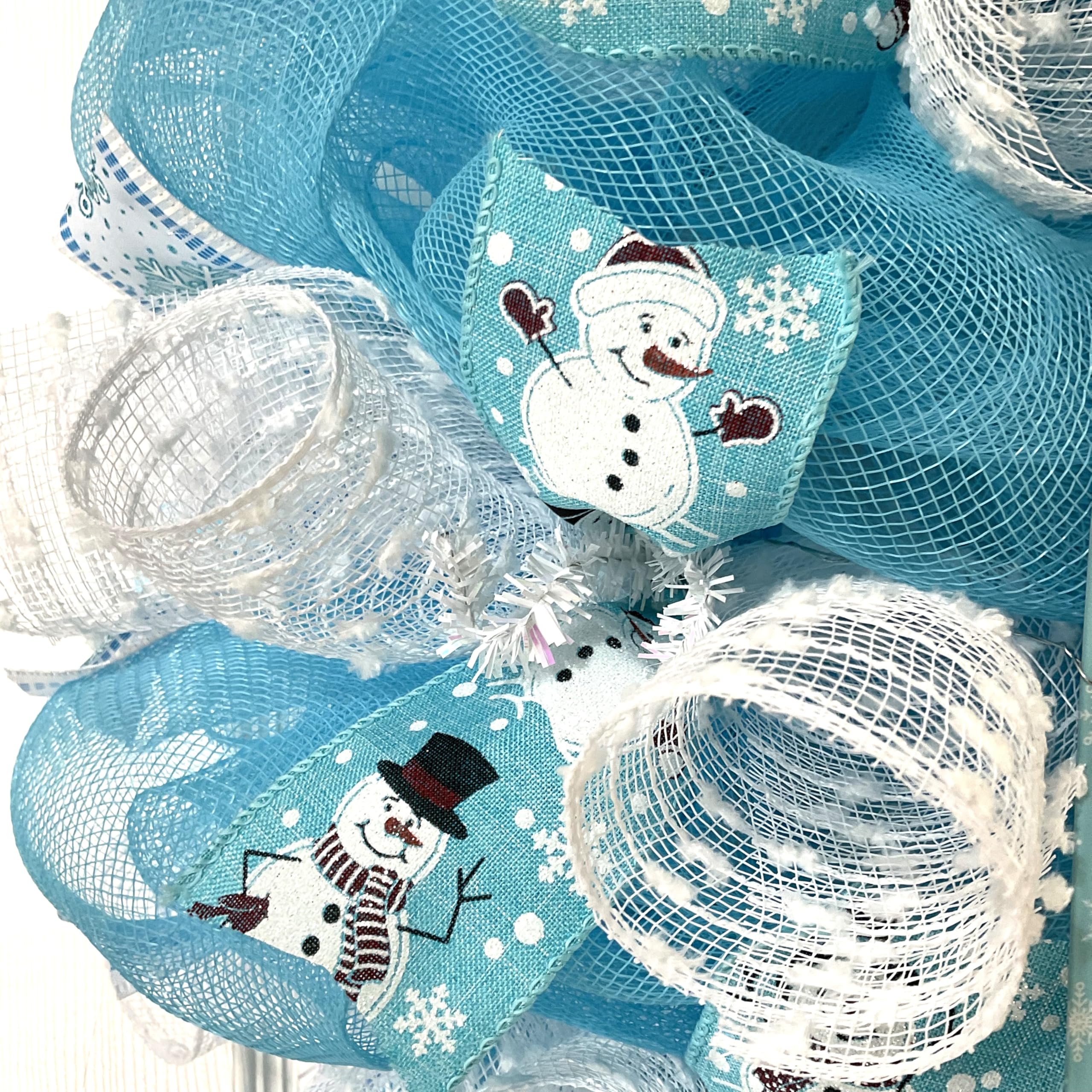 Pale blue deco mesh wreath with white snow flutes