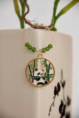 Panda characters and bamboo motif on wine glass charm set