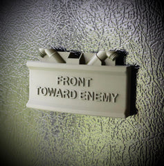 Front Toward Enemy Claymore magnet on metal surface
