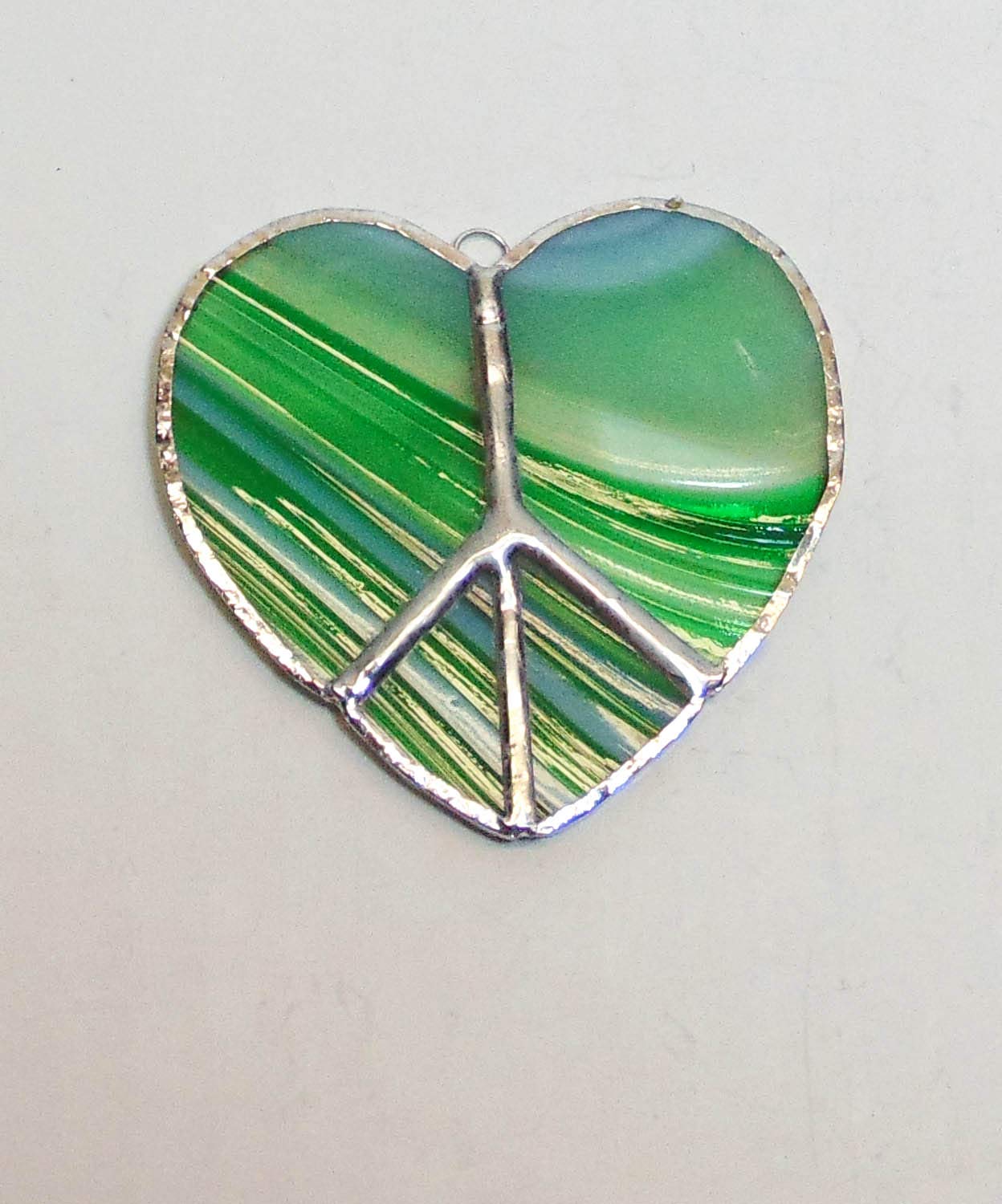 Peace sign sun catcher crafted from stained glass