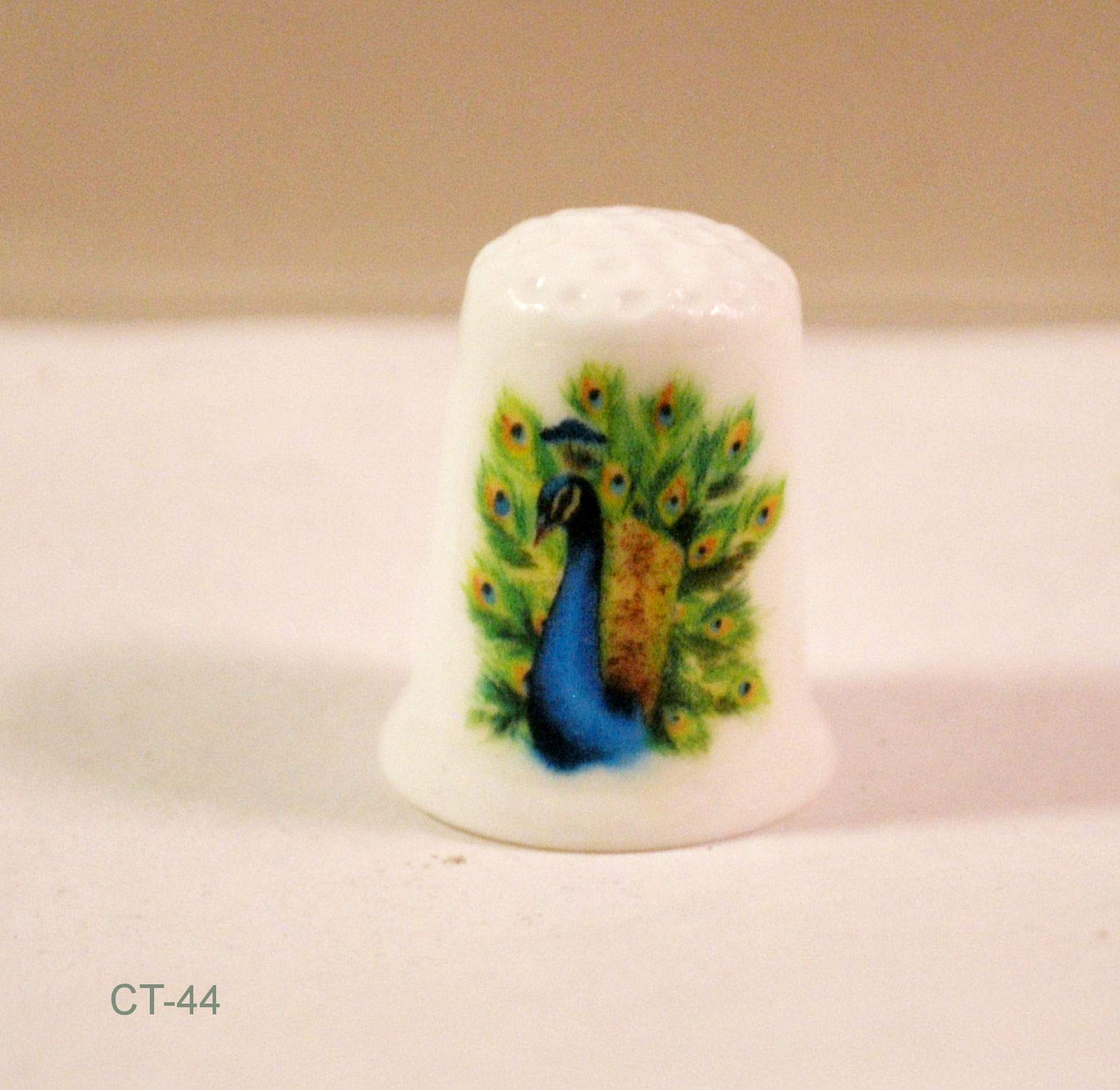 Peacock decal detailing on handmade thimble for sewing memorabilia collectors