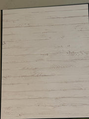 Chipboard cover wrapped in black paper