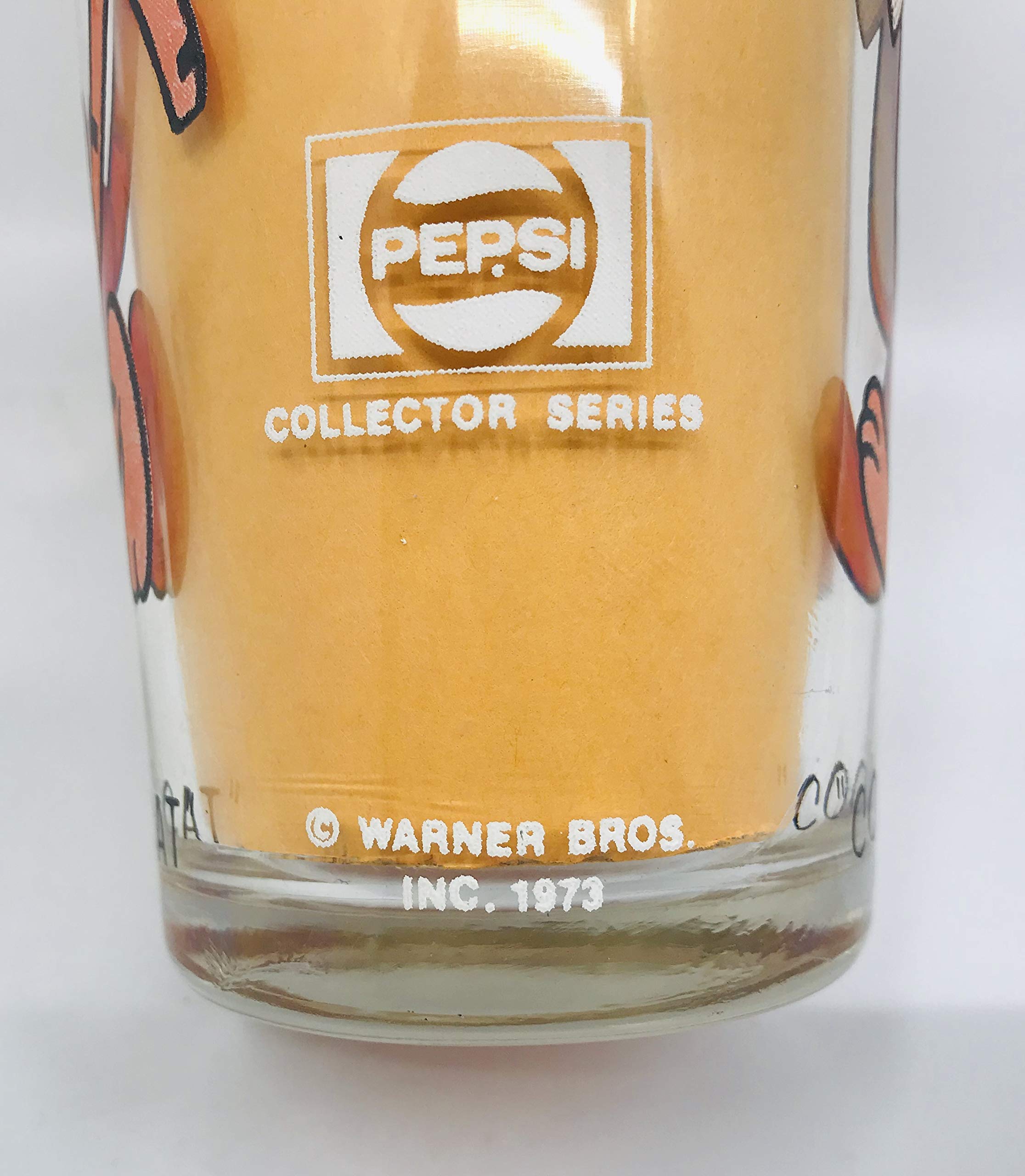 Clear Pepsi glass from the Pepsi Collector Series showing Cool Cat 1973 and Warner Bros Inc printed on both sides