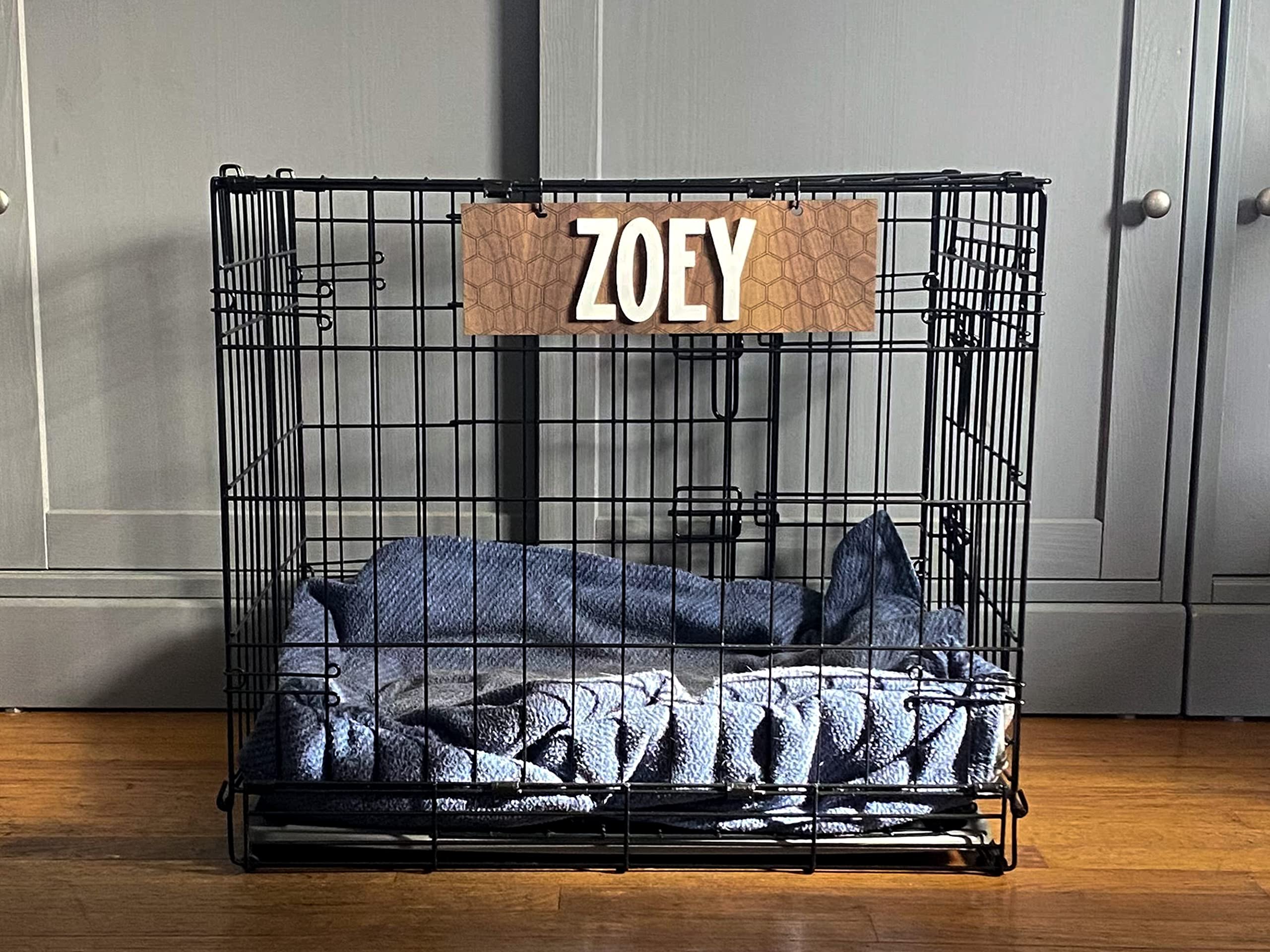 Indoor use dog crate sign with white acrylic lettering