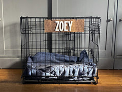 Indoor use dog crate sign with white acrylic lettering