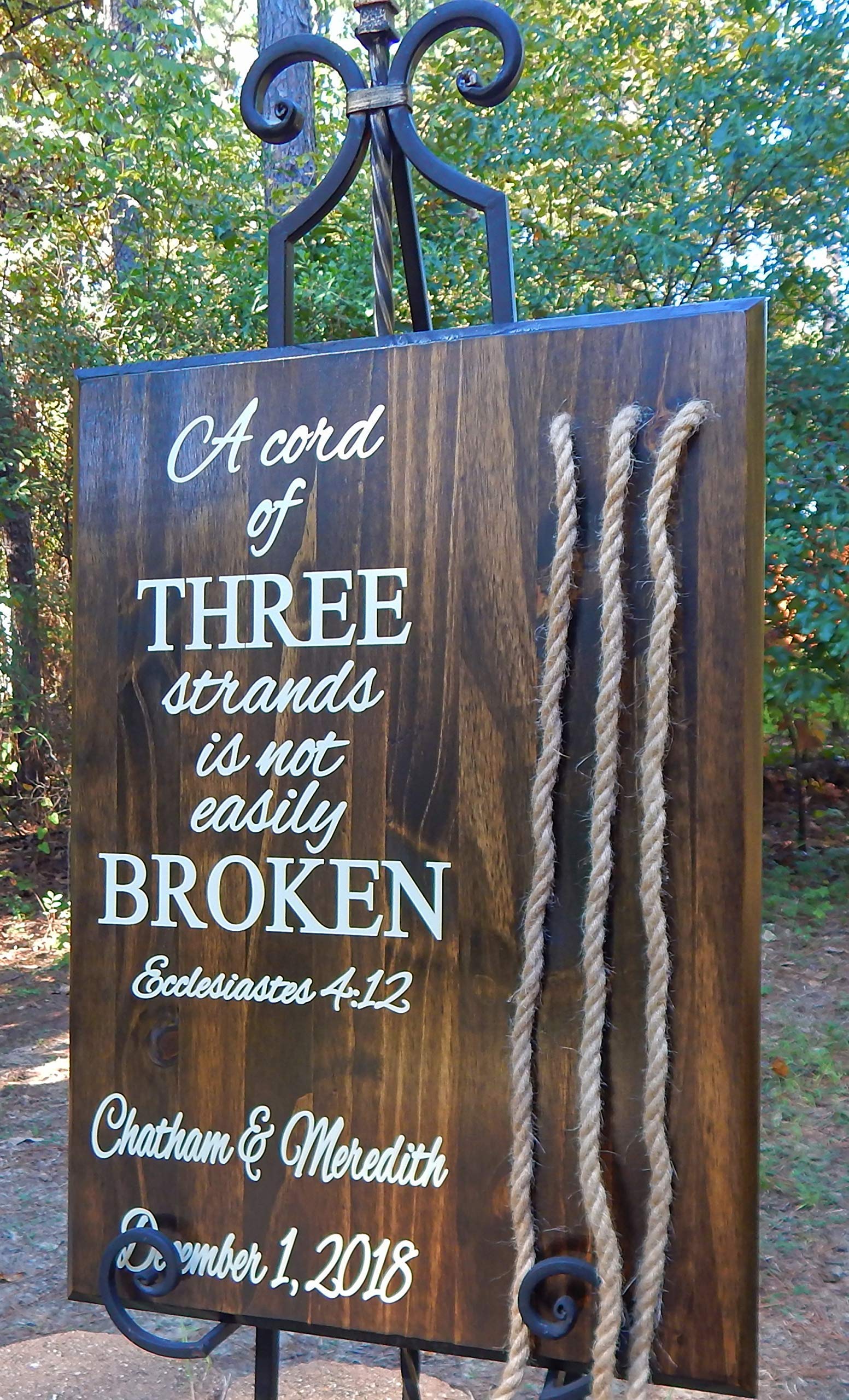 Three jute cords and a sign ready to hang