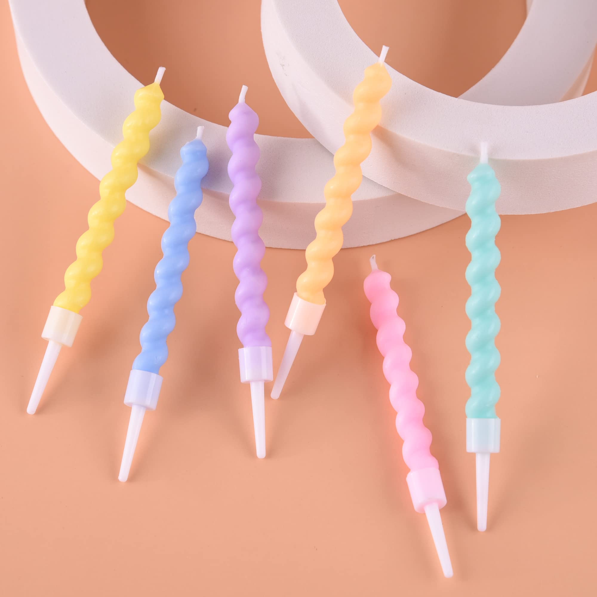 Macaron color palette candles coordinating with baby showers