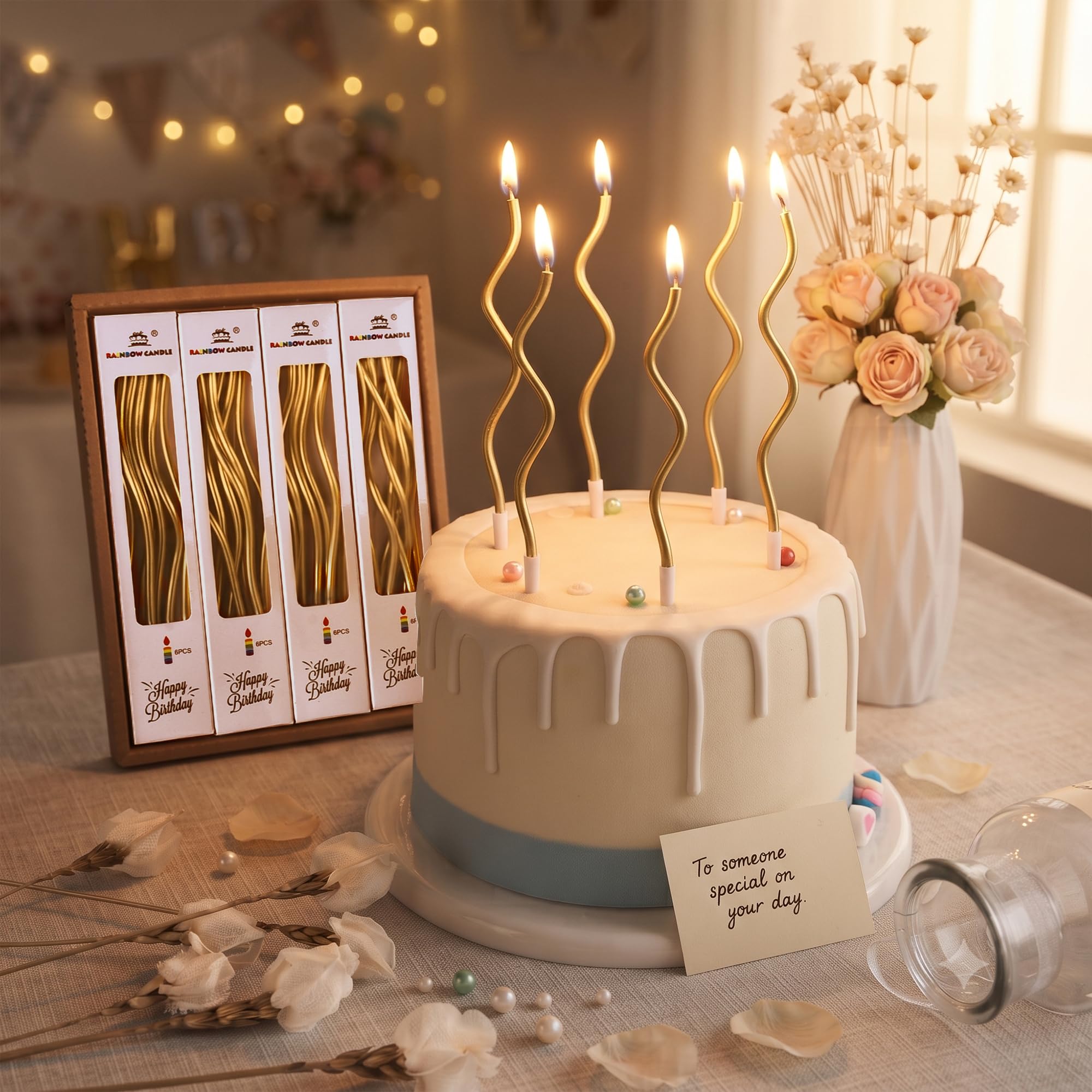 Gold spiral long thin metallic candles with holder on cake