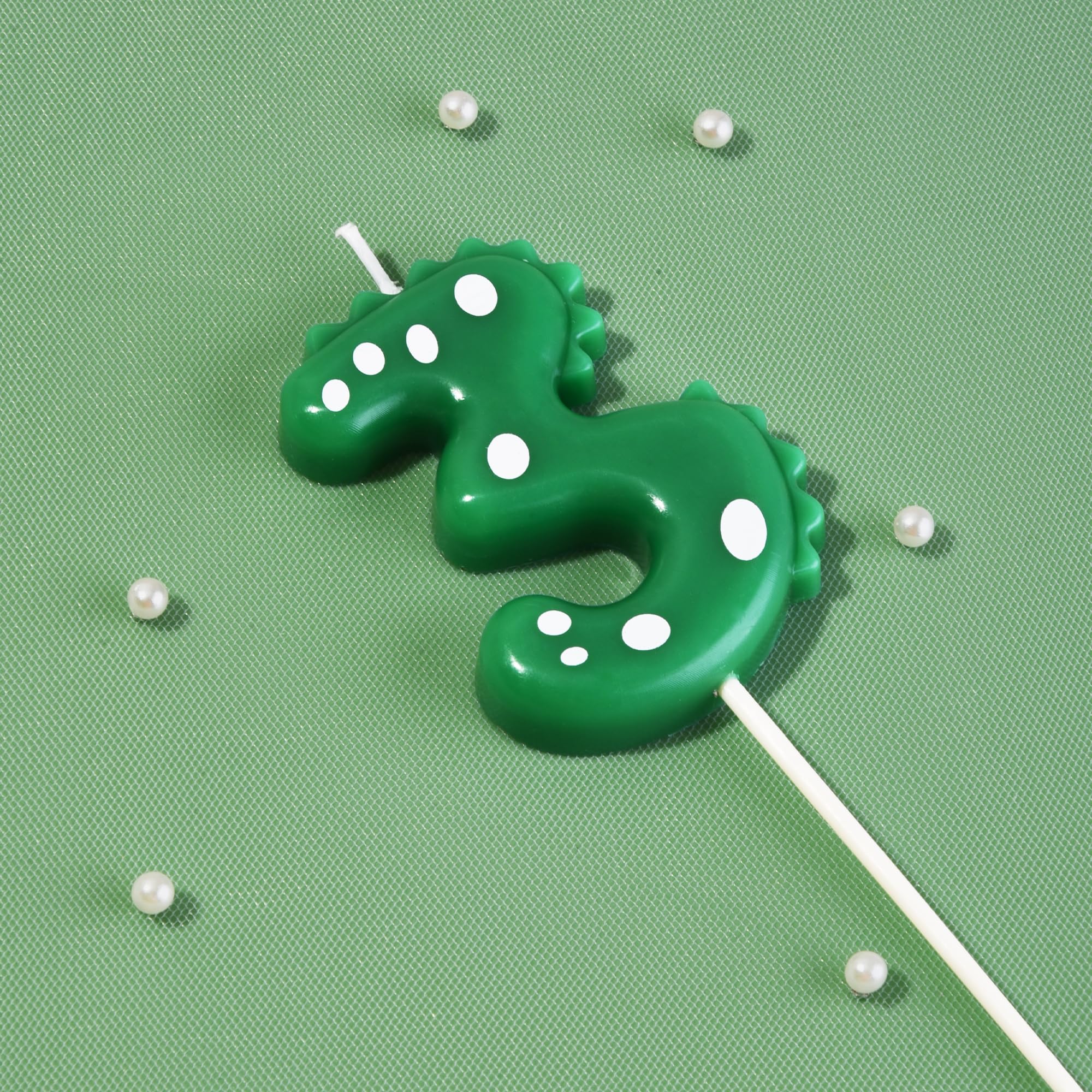 Green dinosaur number candle with holder for cake surface