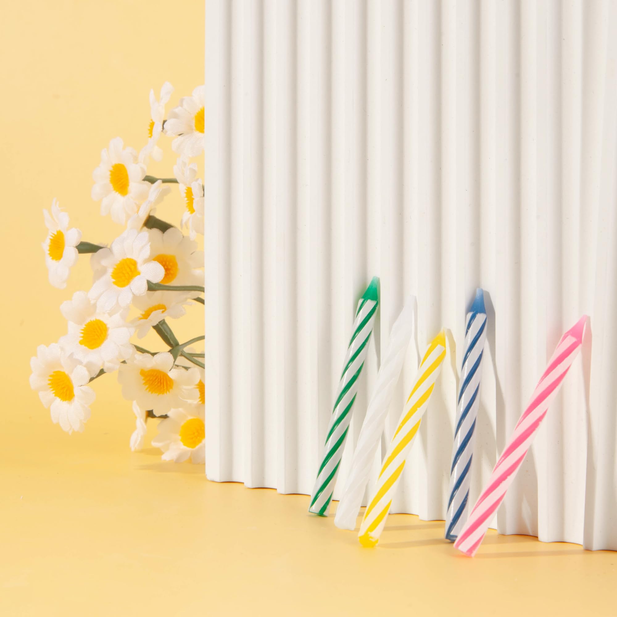 Two packs of 24 spiral birthday candles included