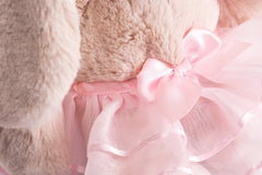 Soft plush bunny with pink bow and slippers