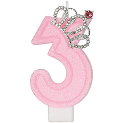 Pink crown number 3 birthday candle on cake