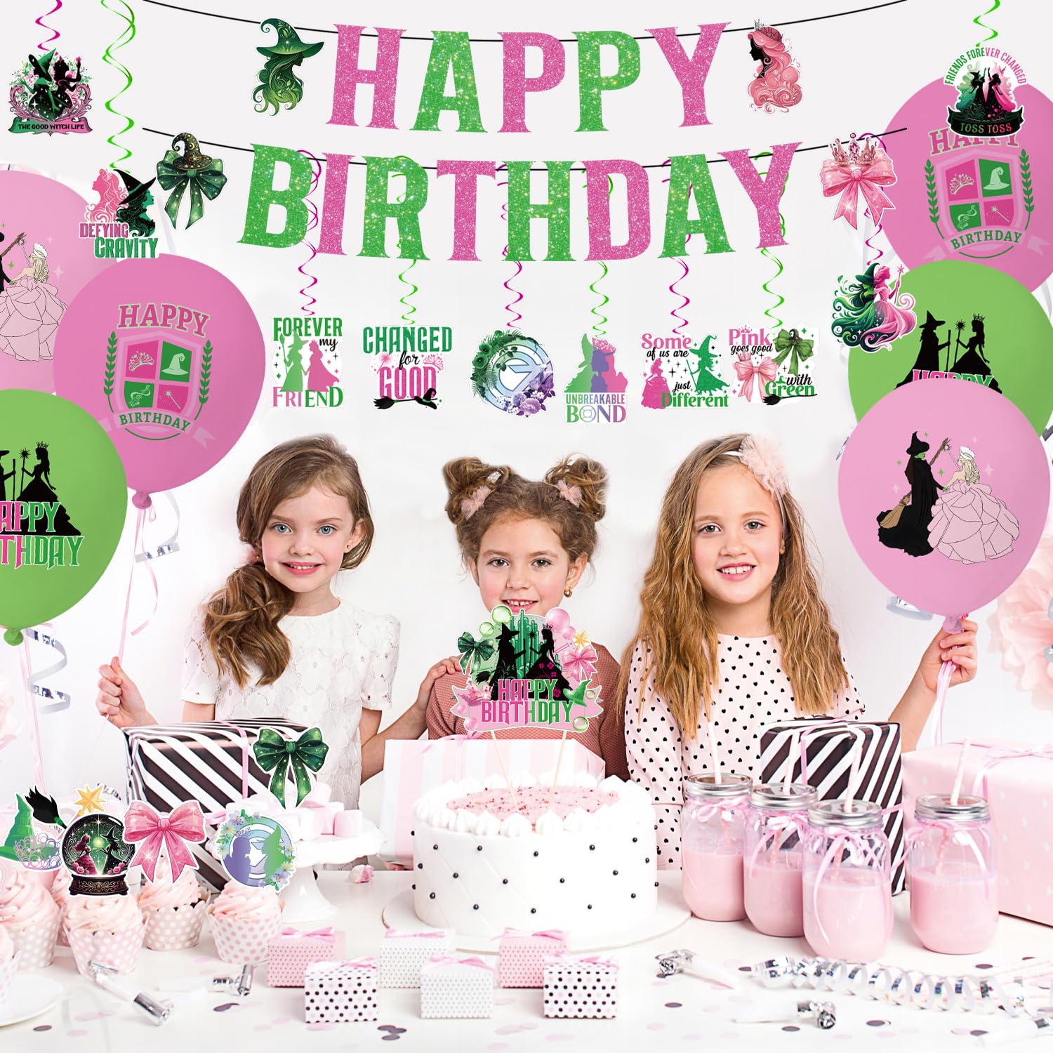 pink and green banner backdrop for witch birthday party
