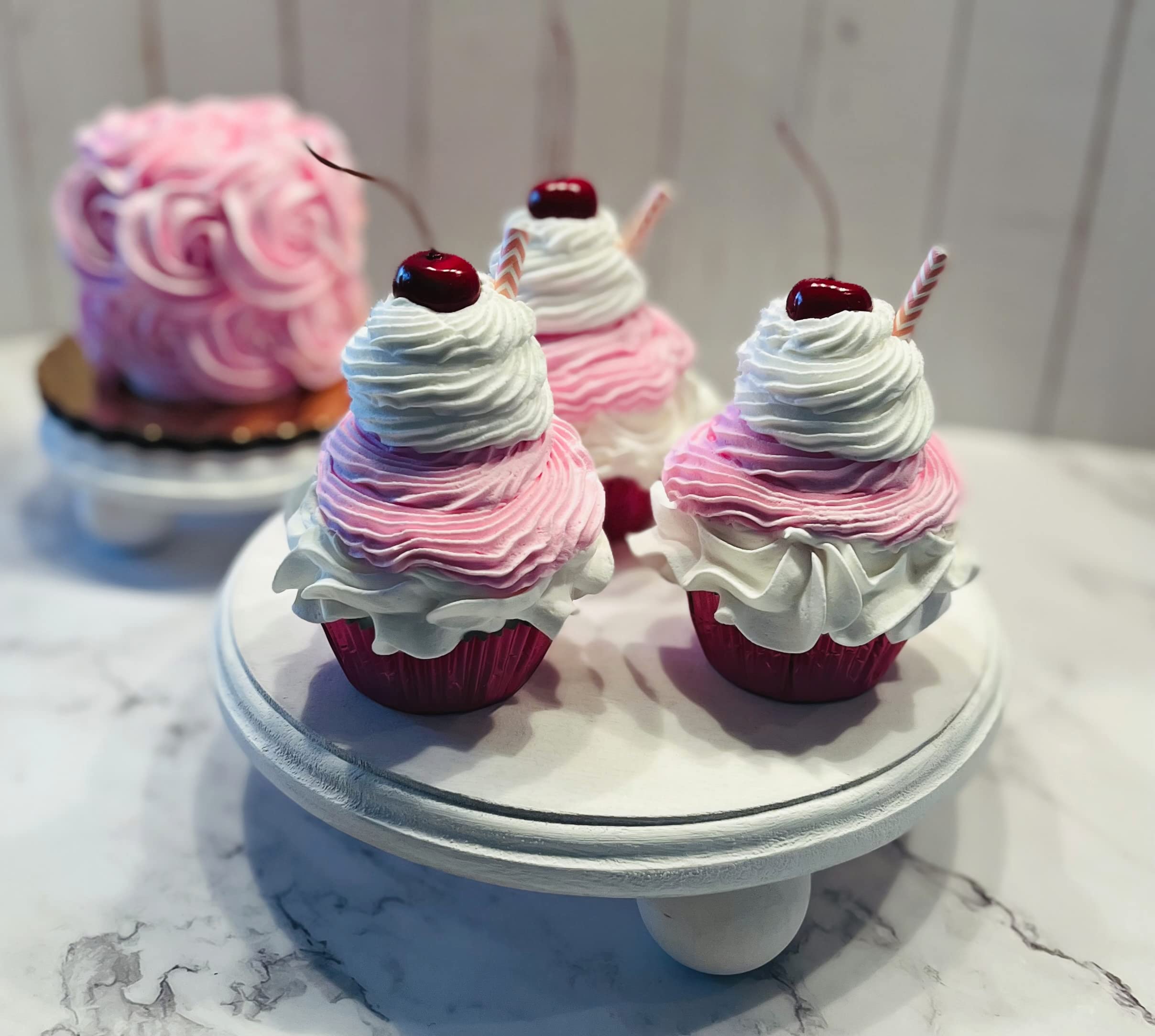 Pink milkshake cupcake size 3.5 inches wide by 5 inches tall including the cherry