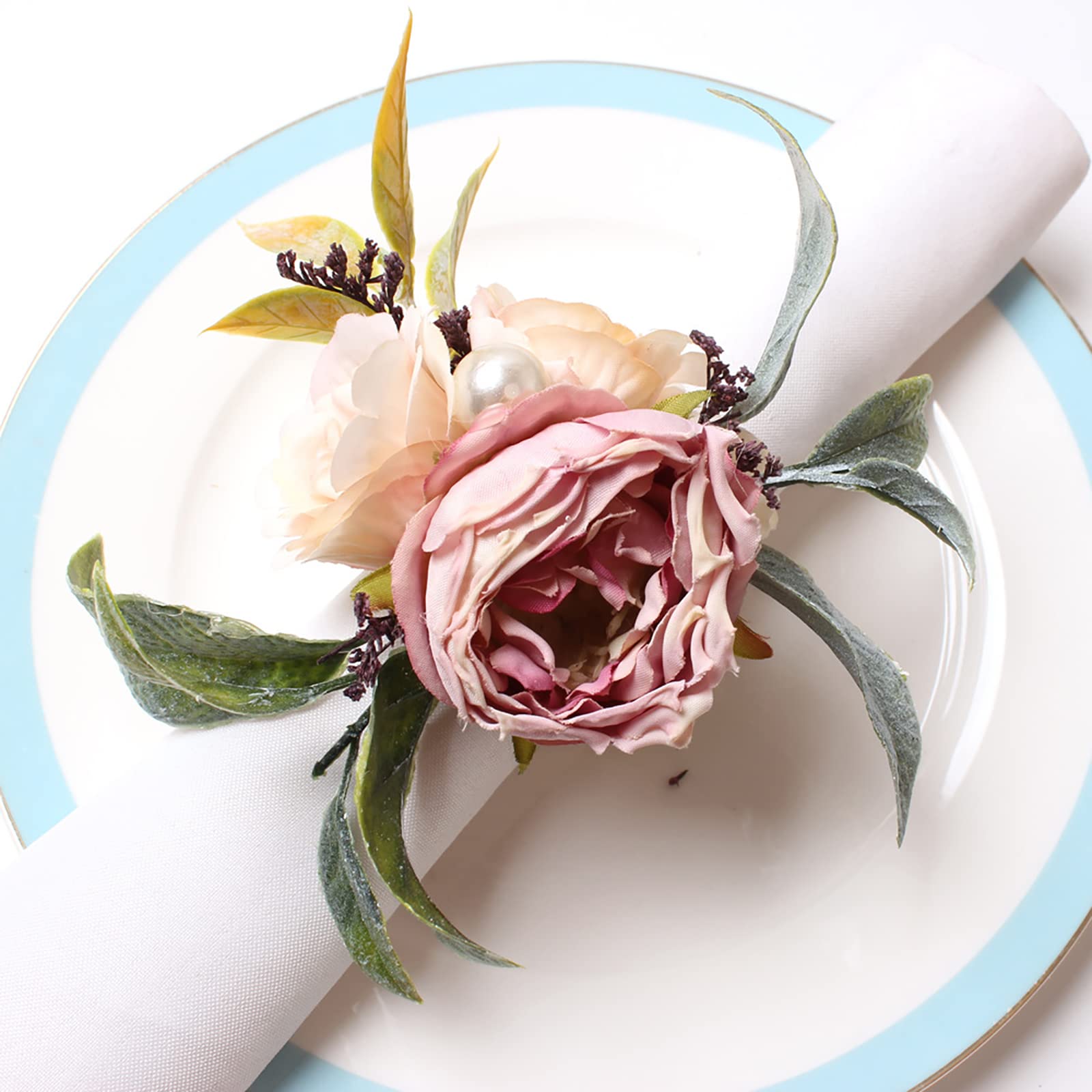 Napkin rings featuring artificial silk peonies and hemp rope