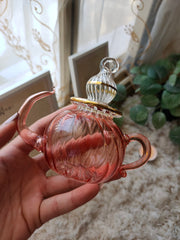 Pink ribbed glass teapot ornament measures 12 cm high 7 cm wide