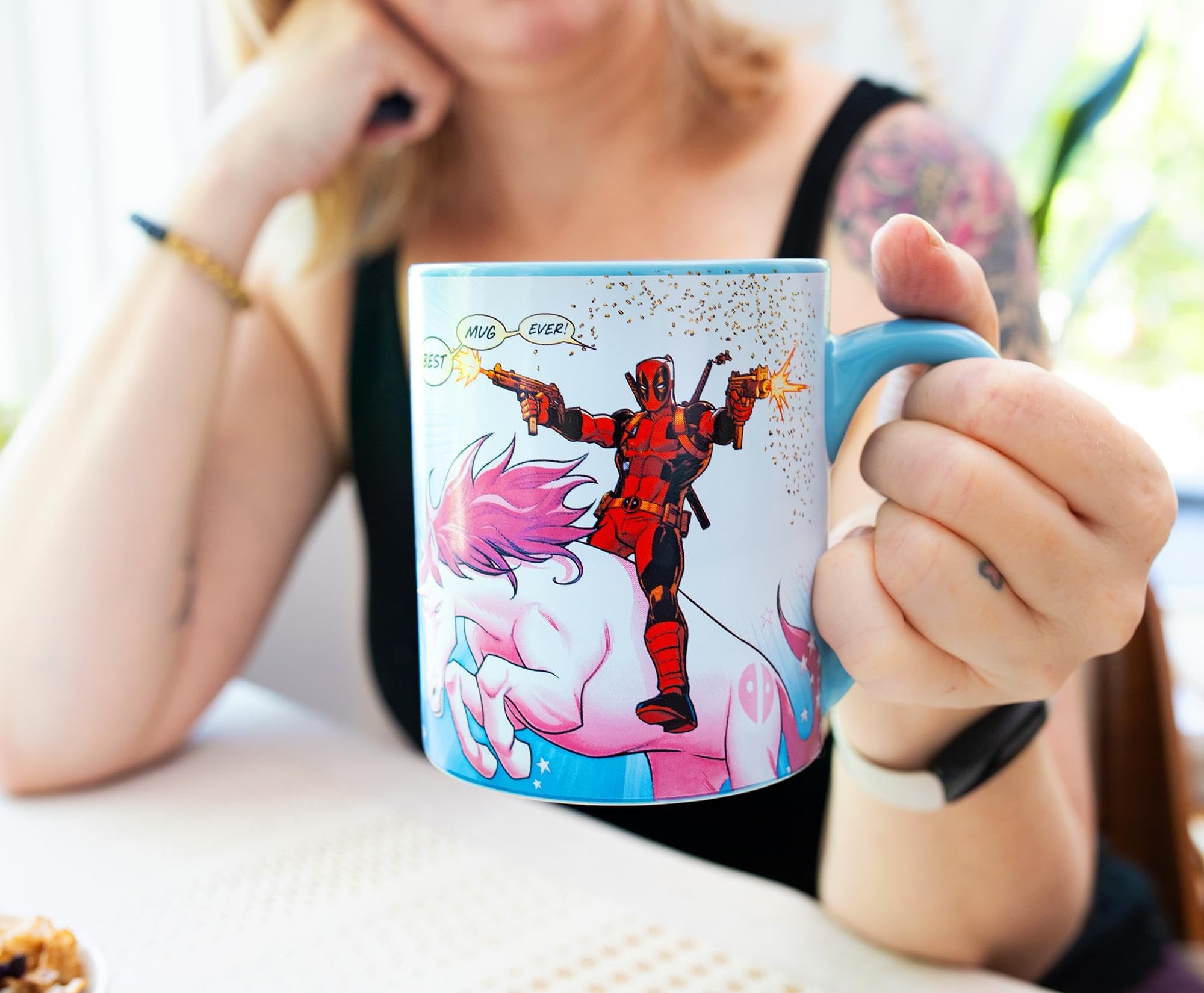 Deadpool riding pink unicorn illustration on mug
