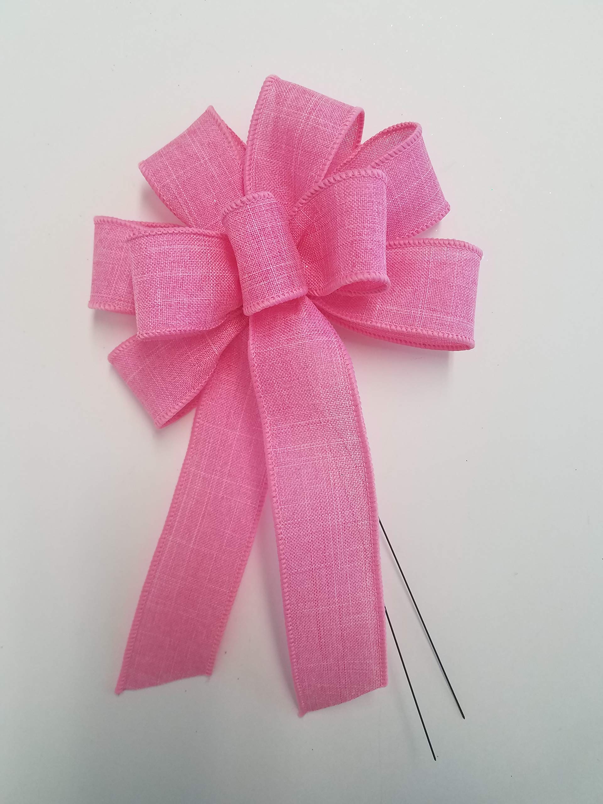 Pink wired wreath bow attached with 18 inch stem wire