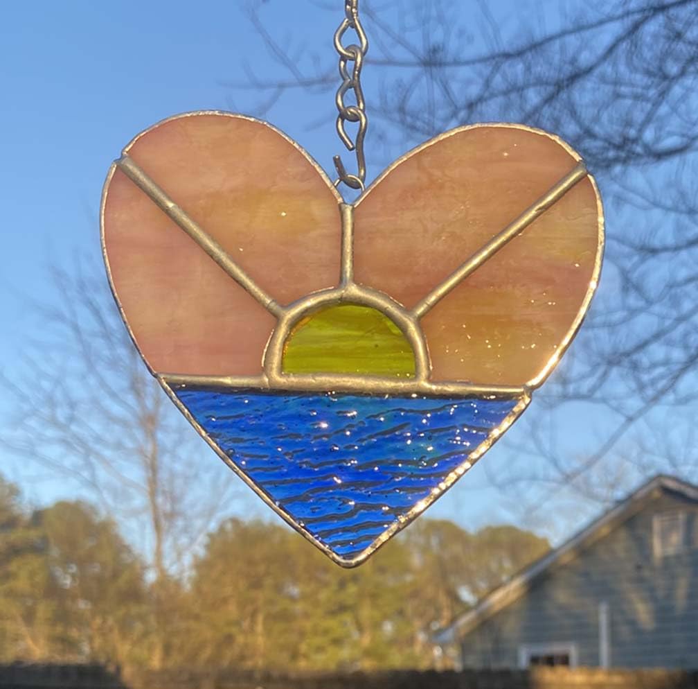 Pink yellow sunrise tones in stained glass piece