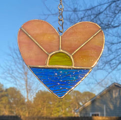 Pink yellow sunrise tones in stained glass piece