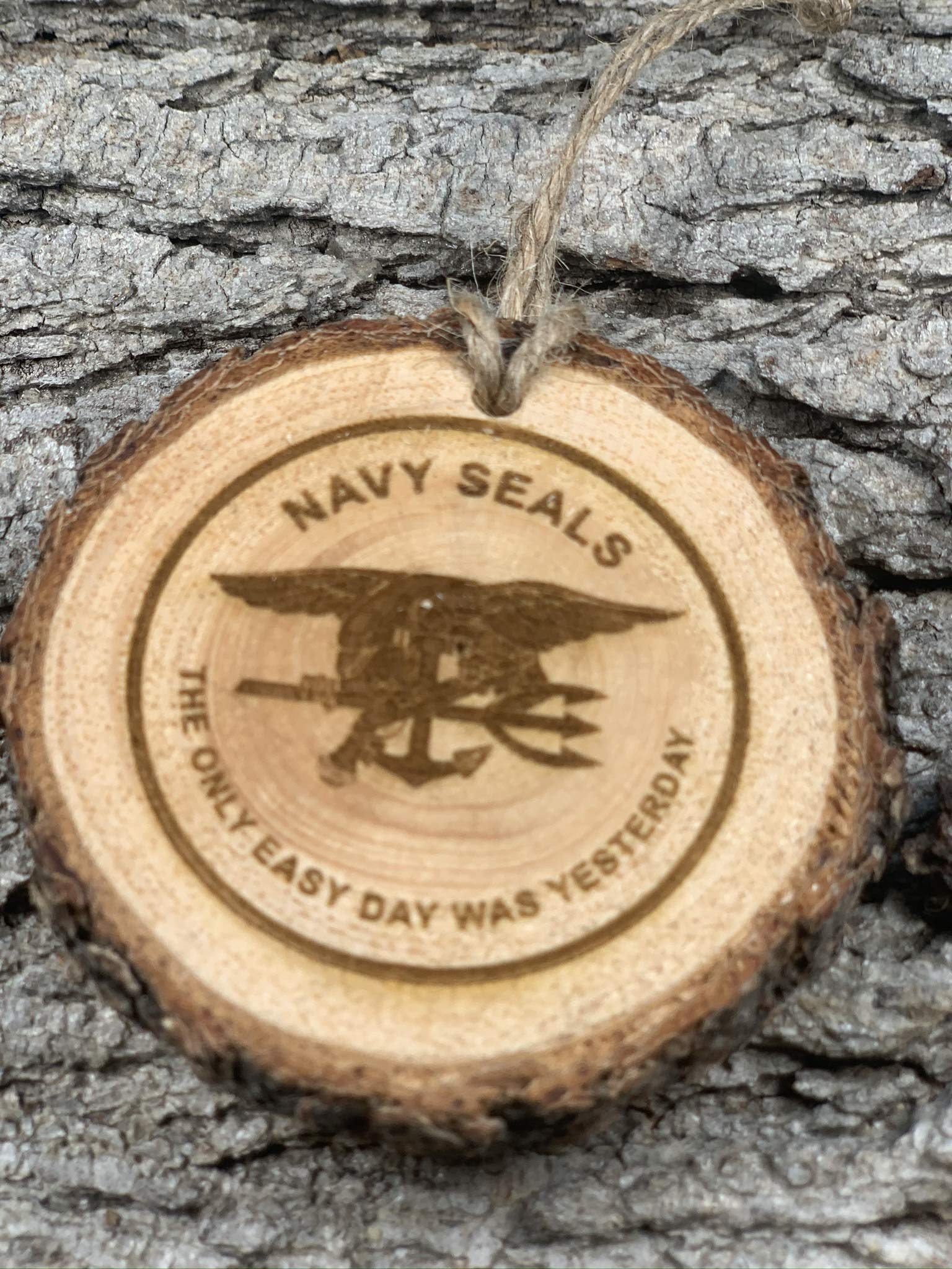 Pinon wood ornament featuring Navy Seal Logo burn detail