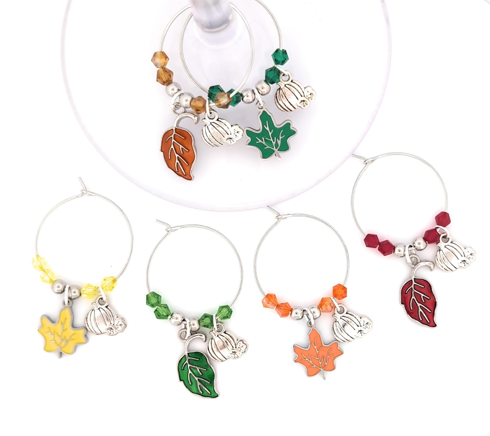 Pixie leaf and pumpkin wine charms on festive fall table setting