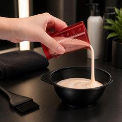 red hair dye measuring cup with clear measurement scale