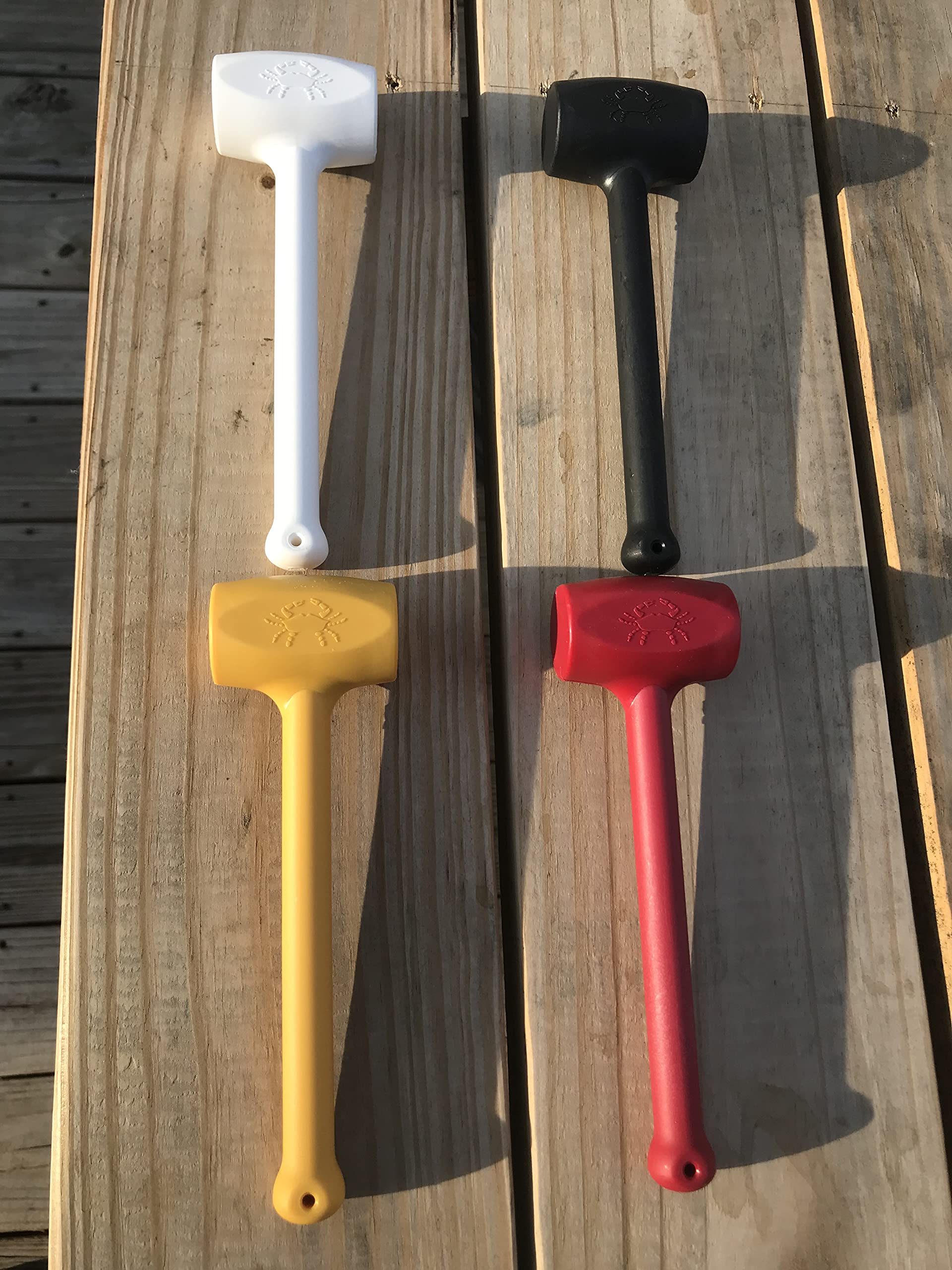 White plastic crab mallet from set of four