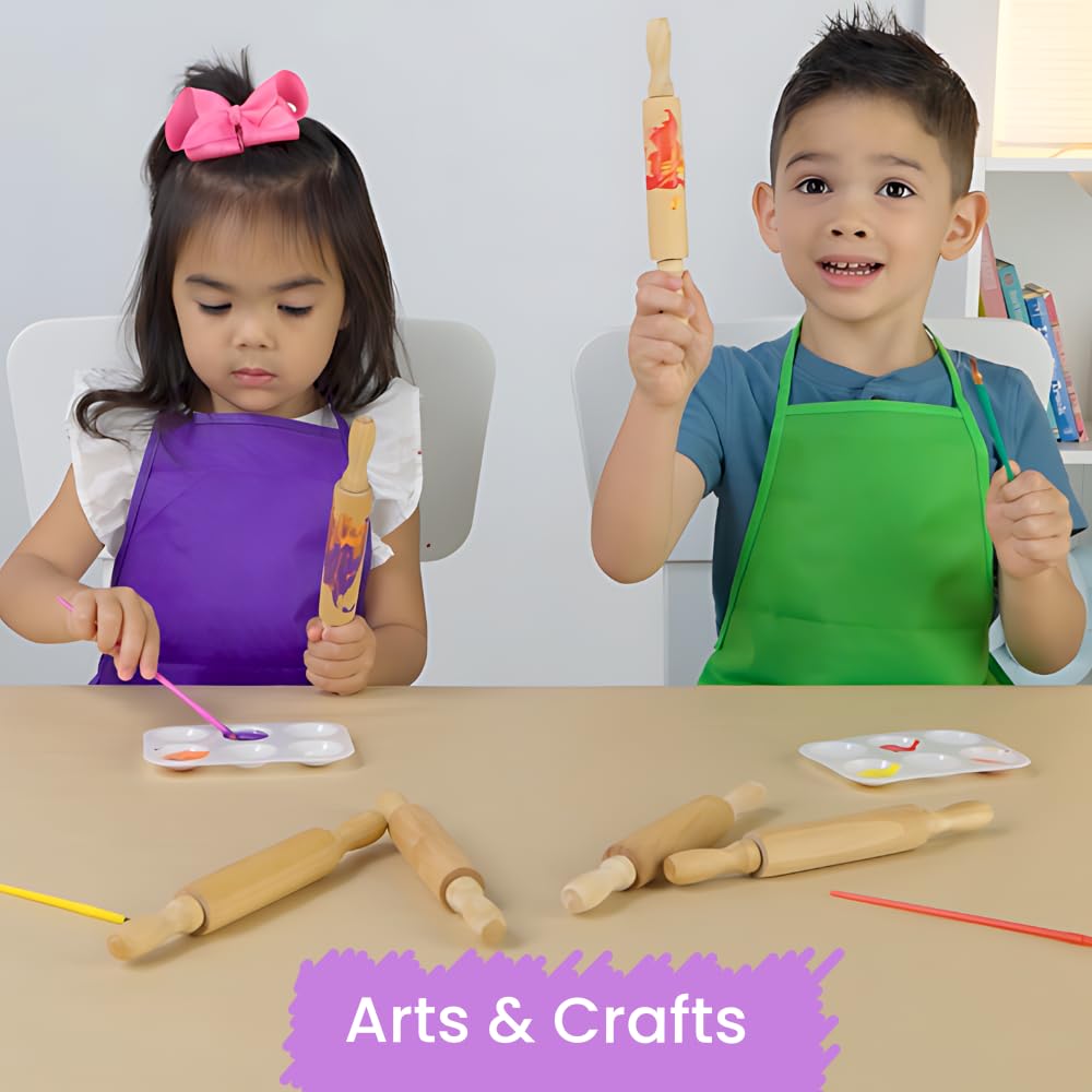 Toddlers using mini rolling pins for fine motor skills