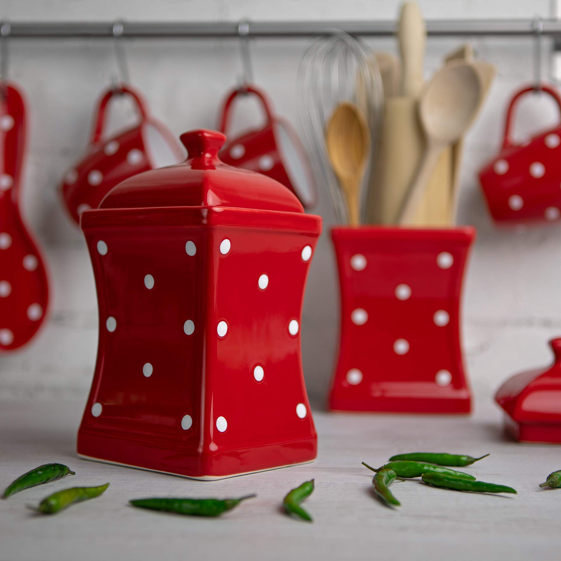 Large handmade ceramic storage jar with lid on kitchen counter
