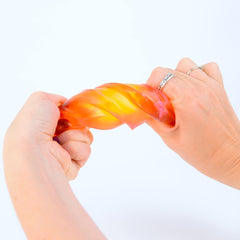PolySquish mystery box being opened revealing colorful core