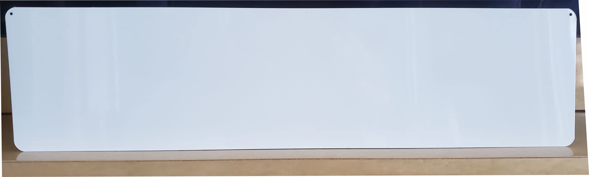 Now Showing sign with film reel graphic printed on aluminum