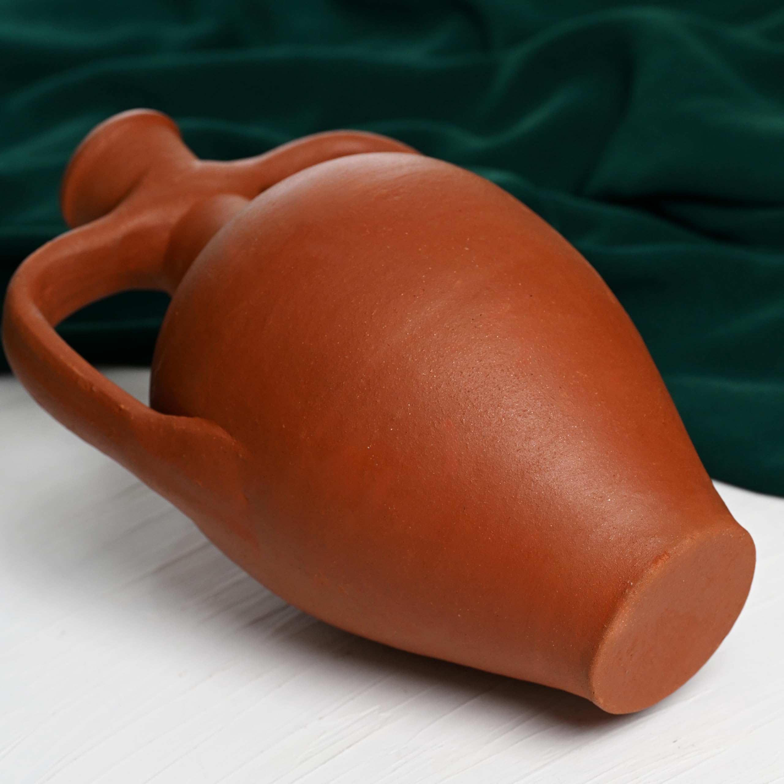 Clay pitcher with simple smooth surface