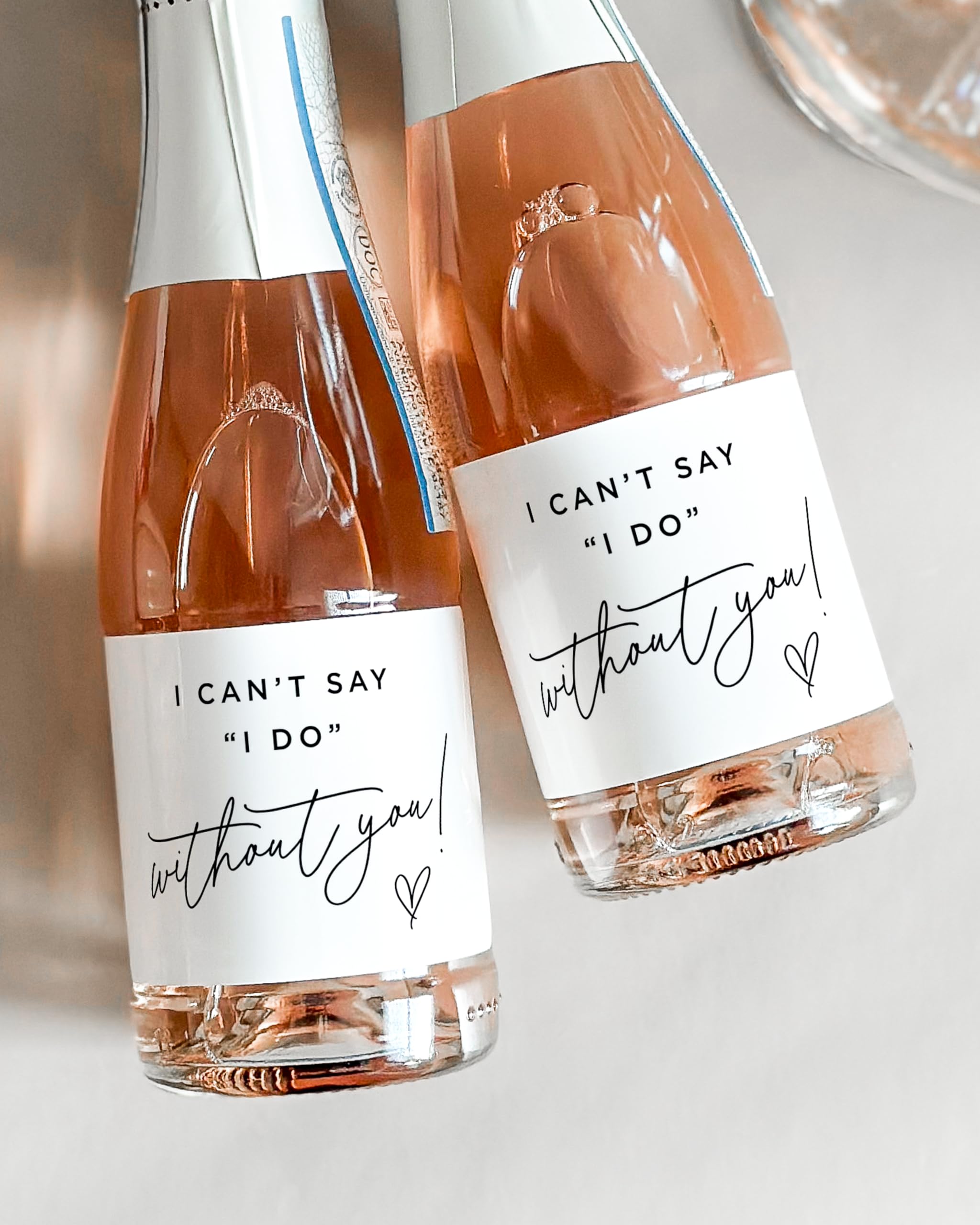 Water resistant and repositionable champagne labels