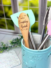 Pride and Prejudice engraved spoon on beechwood surface