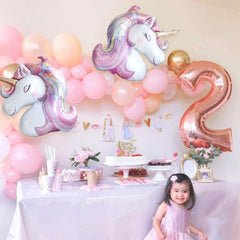 Baby shower unicorn balloons as part of decor