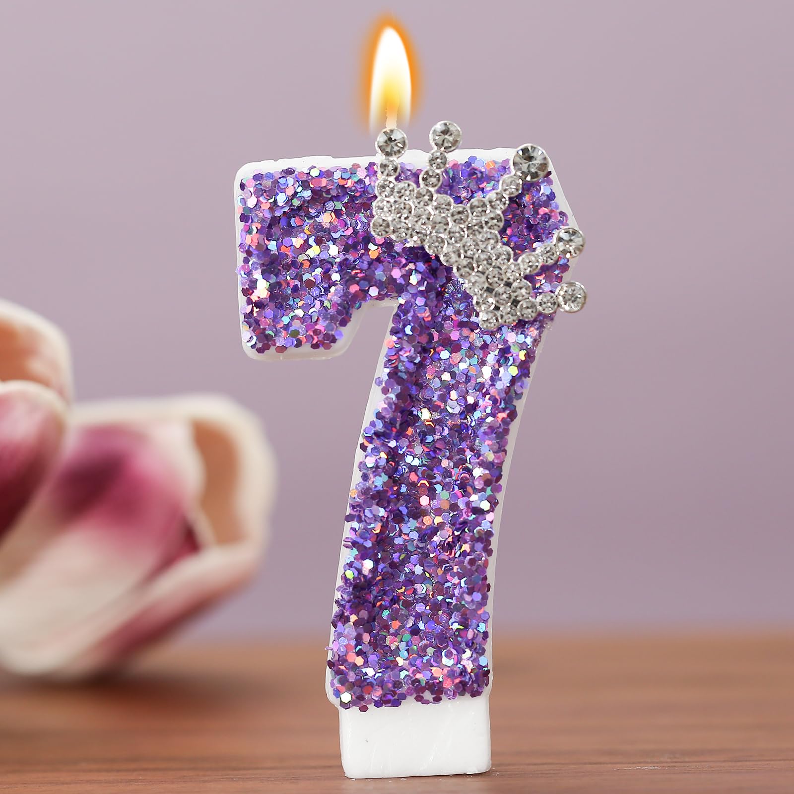 Number 7 cake topper candle with purple crown decoration
