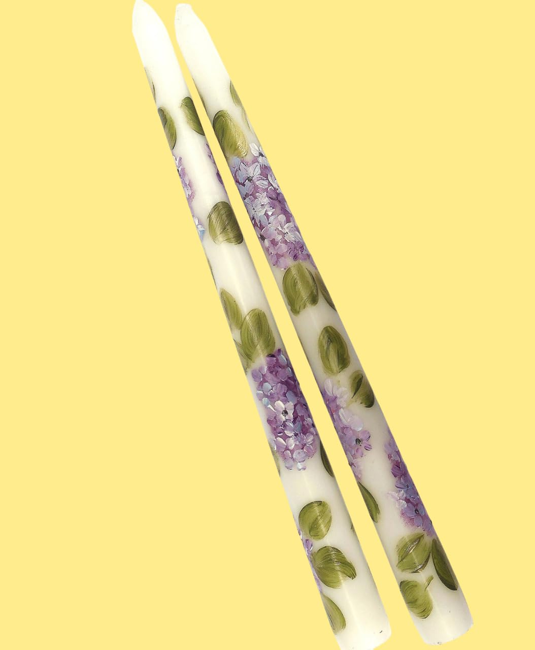 Purple hydrangea design on white taper candle