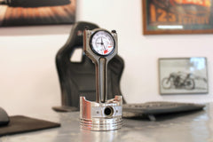 Polished piston clock with protective coating to stay shiny