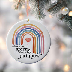 Rainbow pregnancy announcement ornament displayed for holiday decor