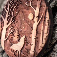 Winter Wolf raw cedar ornament 3x3in laser engraved close up