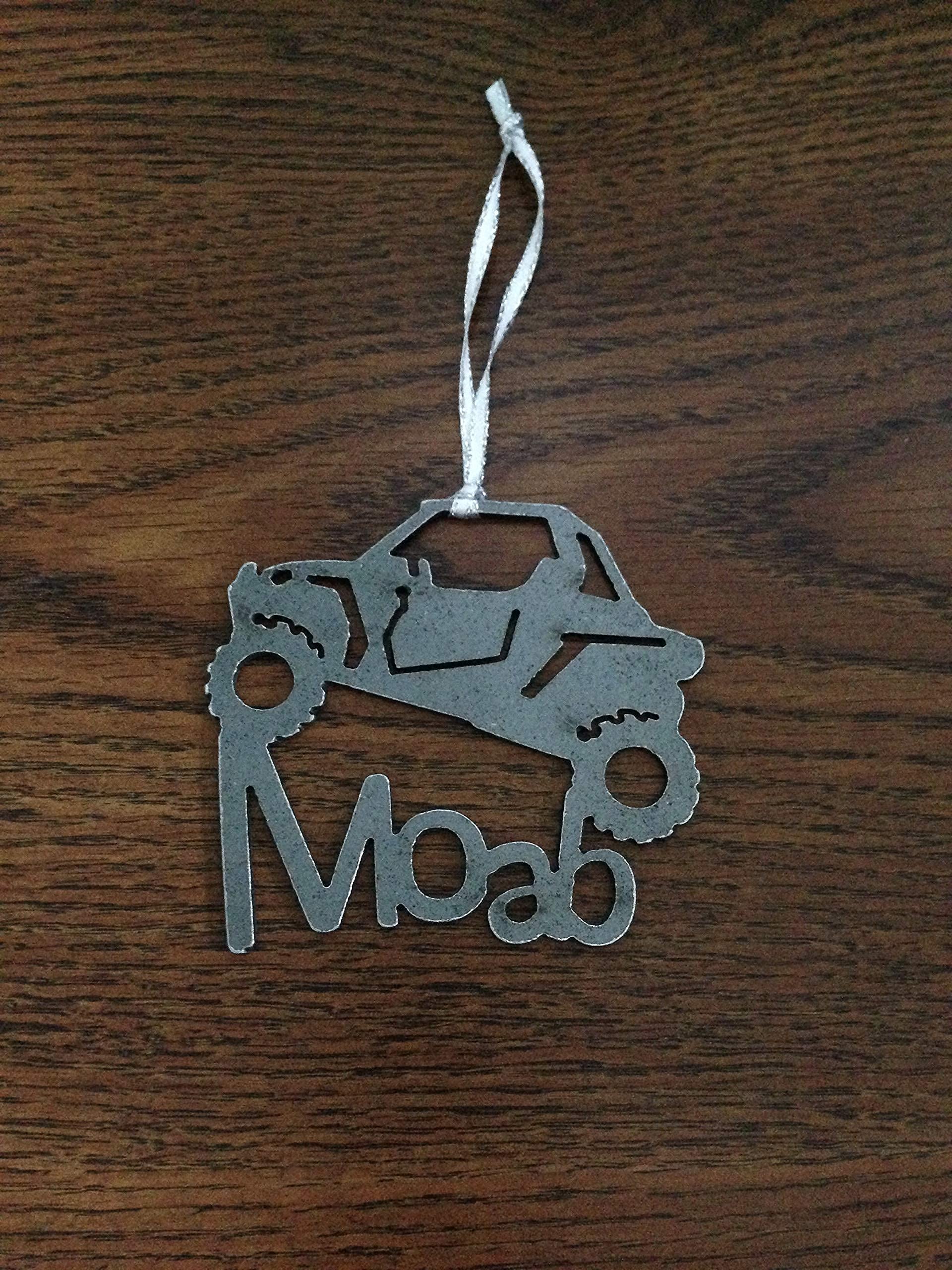 Raw steel ornament without coatings may patina with moisture