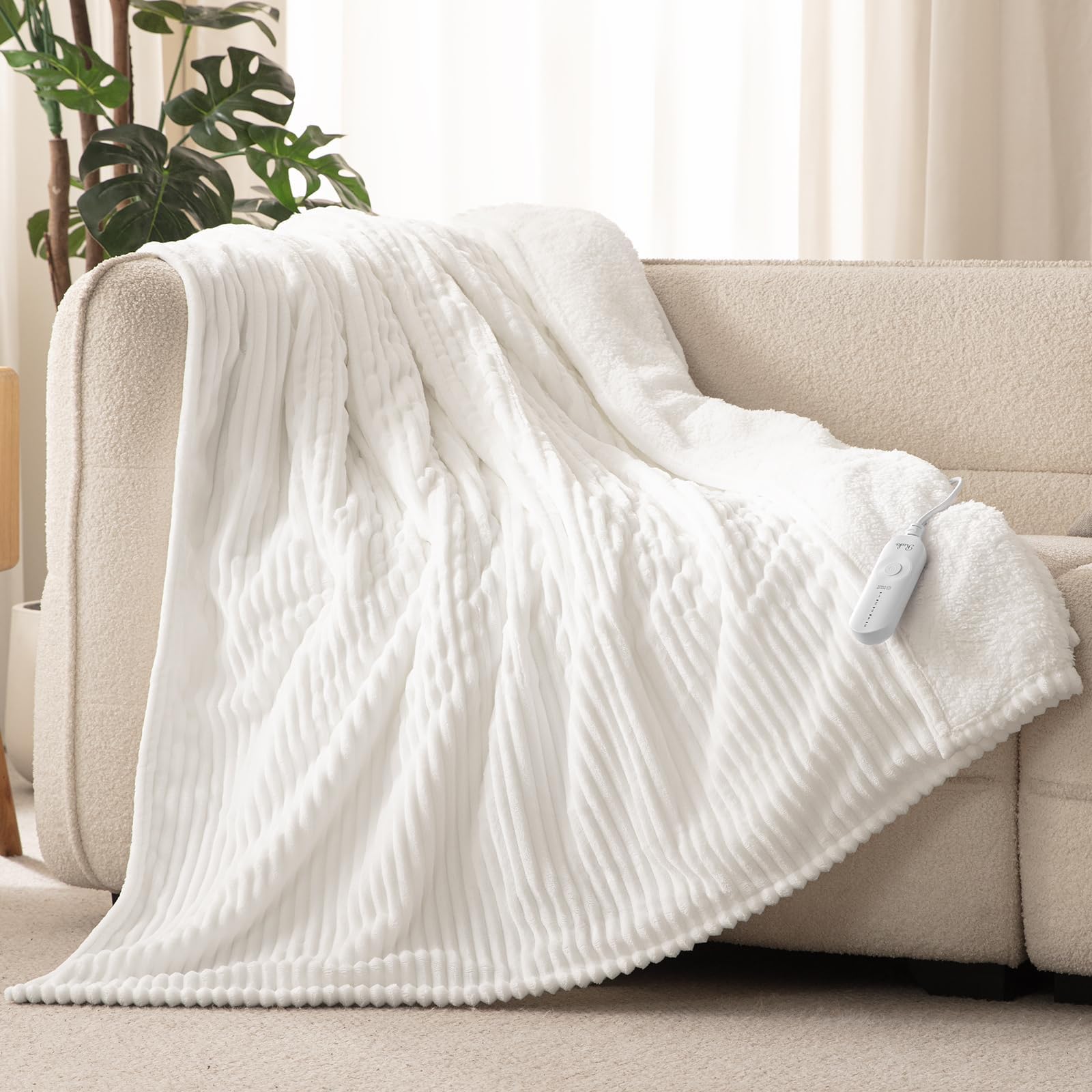 Reaks electric heated throw blanket white 50x60 on bed