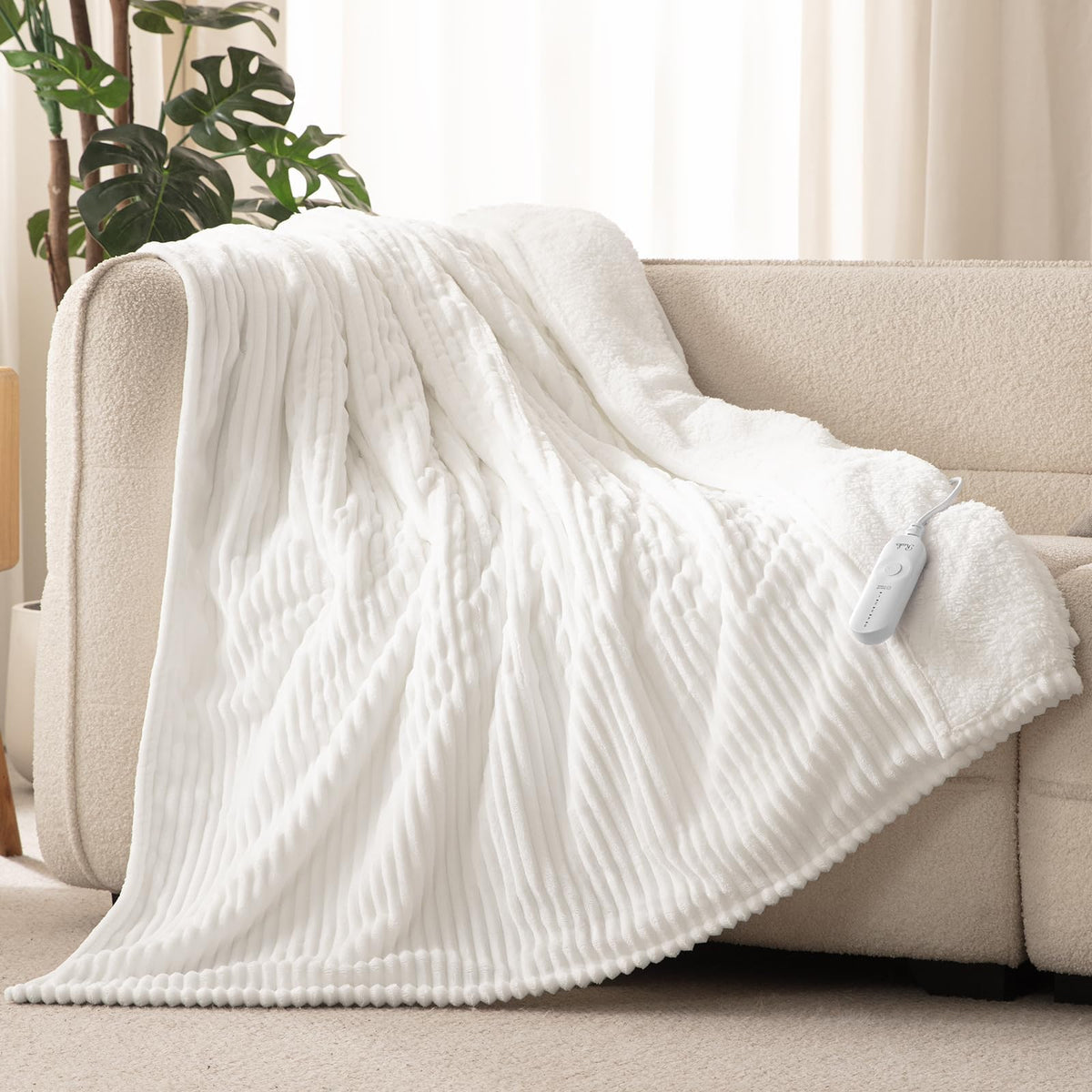 Reaks electric heated throw blanket white 50x60 on bed